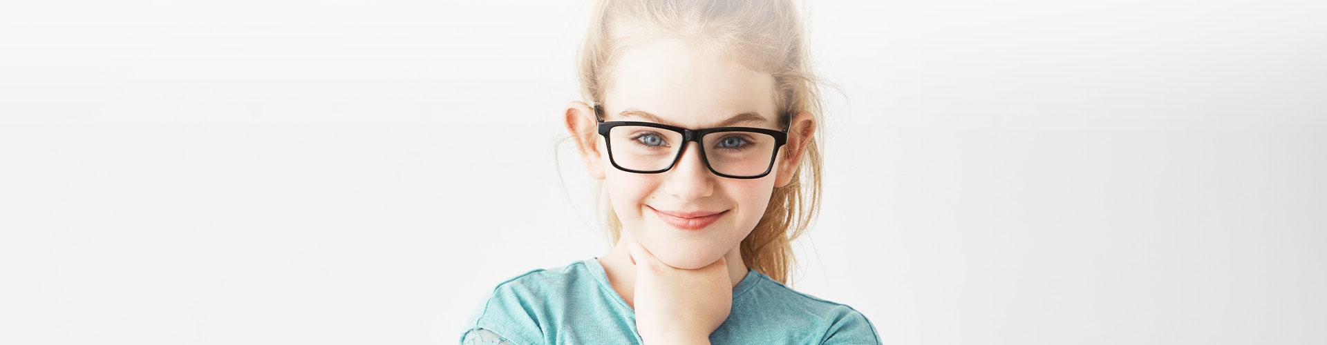 young girl wearing glasses