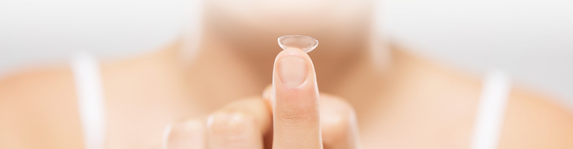 holding contact lens on one finger